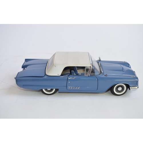 869 - 3 boxed 1/24 diecast car models:
A Danbury Mint 1958 Ford Thunderbird convertible. Good overall cond... 