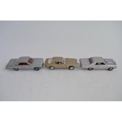 873 - 3 boxed 1/24 die-cast model cars:
Danbury Mint 1965 Pontiac GTO, good box, no paperwork. Wing mirror... 