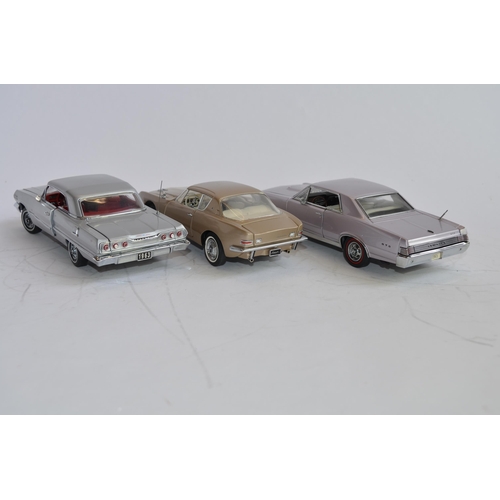 873 - 3 boxed 1/24 die-cast model cars:
Danbury Mint 1965 Pontiac GTO, good box, no paperwork. Wing mirror... 