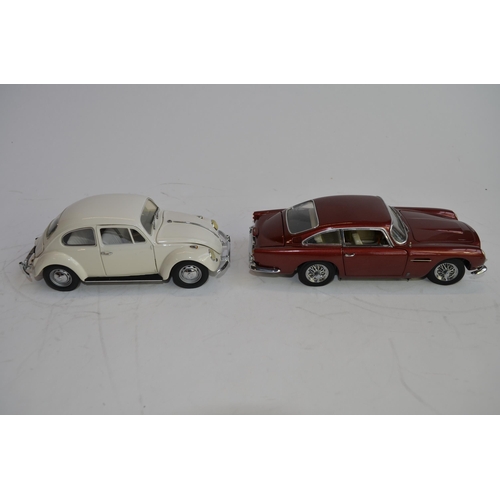 874 - 3 boxed 1/24 scale die-cast european car models:
A Danbury Mint 1964 Aston Martin DB5, box fair, no ... 