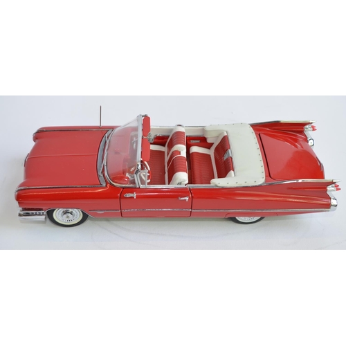 858 - A Danbury Mint 1/24 diecast 1959 Series 62 red Cadillac convertible.