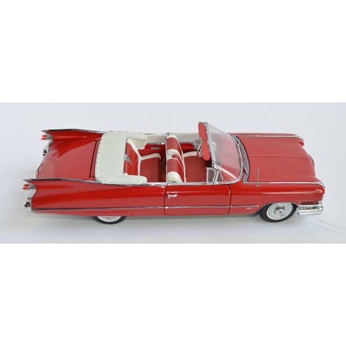 858 - A Danbury Mint 1/24 diecast 1959 Series 62 red Cadillac convertible.