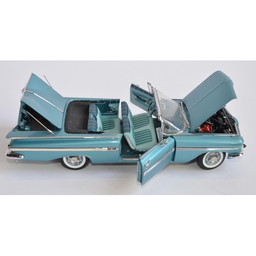 859 - A Danbury Mint 1/24 diecast 1959 Chevrolet Impala Convertible, boxed with COA and roof.