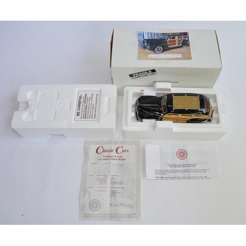841 - A boxed Danbury Mint 1/24 1942 Chrysler Town And Country, with paperwork.