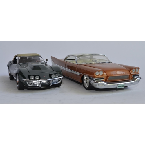 877 - 2 1/24 Danbury Mint diecast car models:
A boxed 1957 Chrysler 300C Custom. Model in excellent extern... 