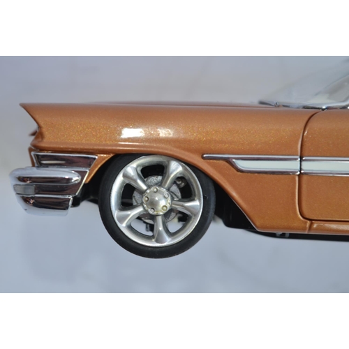 877 - 2 1/24 Danbury Mint diecast car models:
A boxed 1957 Chrysler 300C Custom. Model in excellent extern... 