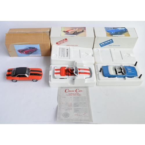 878 - 3 1/24 die-cast Chevrolet Camaro models:
A Franklin Mint 1969 orange and black, fair condition, some... 