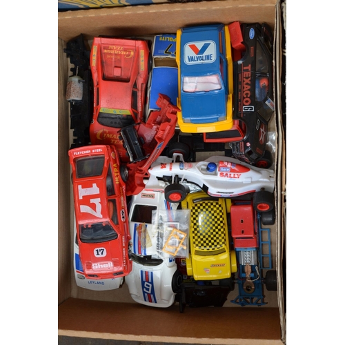 921 - A collection of Scalextric hand controllers, cars (all A/F), an Auotostart set, transformers and spa... 