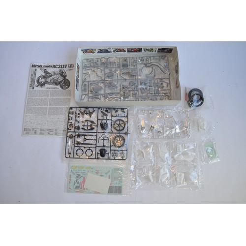 930 - A Tamiya 1/12 Repsol Honda RC211V model kit, complete and unstarted, all bags still factory sealed, ... 