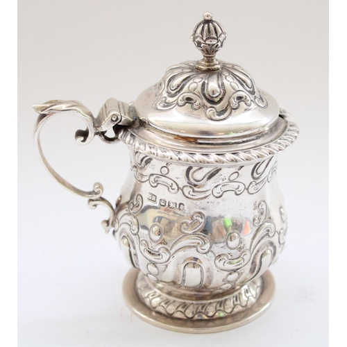 646 - Victorian pair of hallmarked silver condiment pots with scrolled handles, hinged lids and baluster f... 