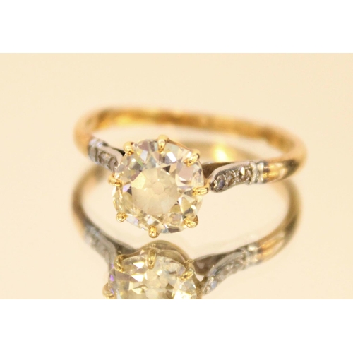 681 - Yellow metal diamond solitaire ring, the central round cut diamond in claw setting set with white me... 