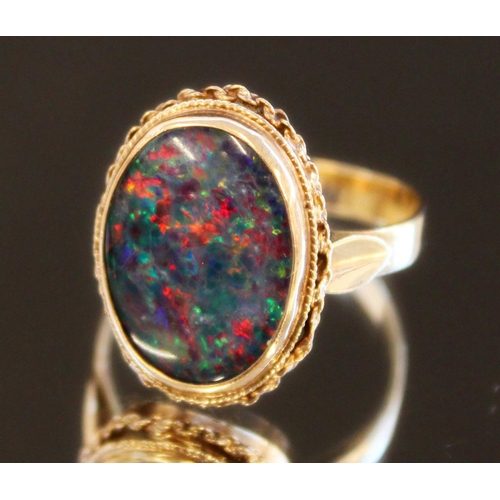 682 - 9ct yellow gold ring set with large opal, stamped 9ct, size P, 4.0g