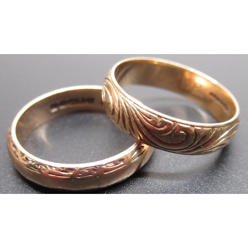 18 - 9ct yellow gold wedding band with engraved design, stamped 375, size O, and another similar, stamped... 
