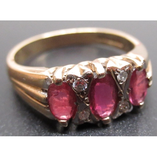 2 - 9ct yellow gold ring set with three oval cut rubies and four brilliant cut diamonds, stamped 375, si... 