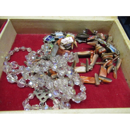 43 - Vintage jewellery box containing costume jewellery including a shell necklace, an enamel shield trav... 