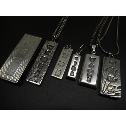 50 - Five hallmarked Sterling silver ingot pendants, three on silver chains, stamped 925, and a hallmarke... 