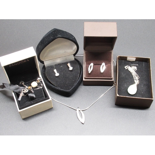 35 - Hallmarked sterling silver pendant set with single diamond, on silver chain, and matching earrings, ... 
