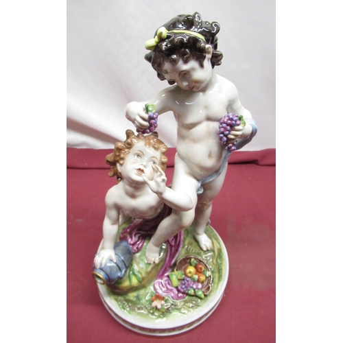 1151 - Capo-di Monte style Volkstedt porcelain model of two cherub grape pickers, on circular base, H35cm