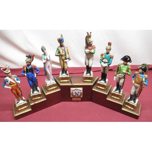 1154 - Set of six Naples Continental porcelain models of Napoleonic Soldiers, on stepped plinth, and anothe... 