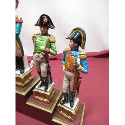 1154 - Set of six Naples Continental porcelain models of Napoleonic Soldiers, on stepped plinth, and anothe... 