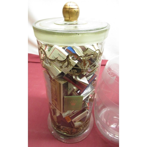 1162 - Vintage clear glass Pasta jar and cover with painted detail, containing a collection of book match c... 