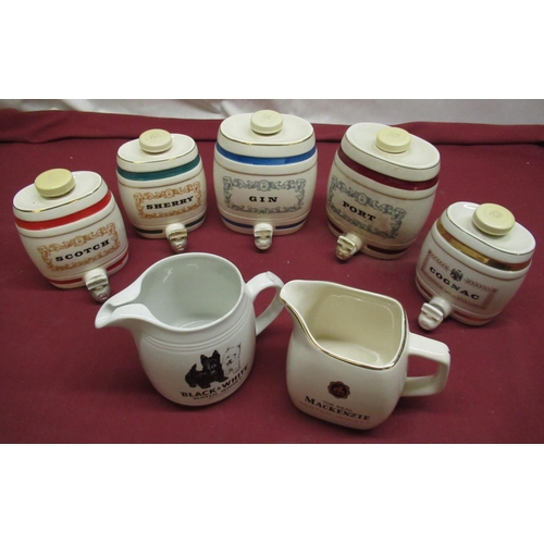 1170 - HCW Black and White whisky water jug, Wade Mackenzie  jug and a five Wade miniature Spirit barrels (... 