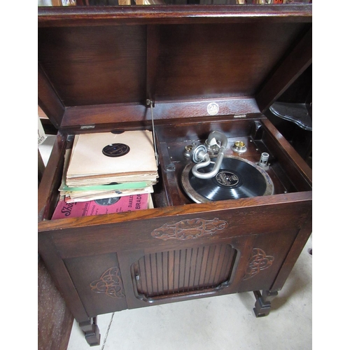 77 - Geisha wind up oak cased cabinet Gramophone, with tambour speaker door, W82cm D49cm H86cm