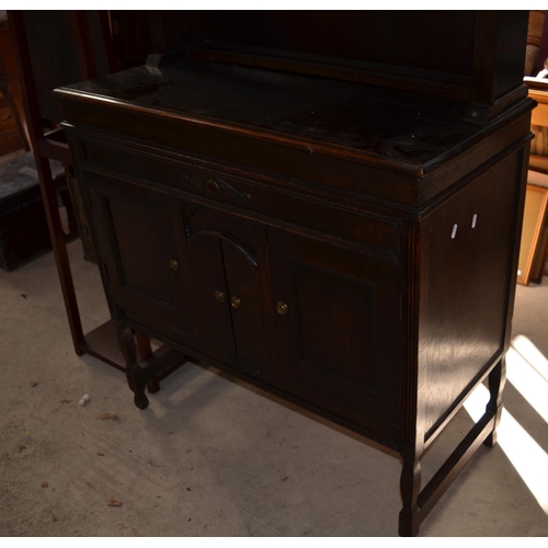 92 - C20th oak Dutch type dresser, arched top above three cupboards on angular supports, W93cm D44cm H190... 