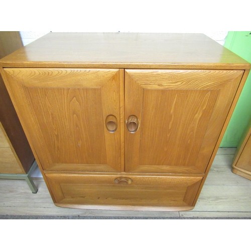 1177 - Vintage Blonde Ercol TV cabinet with two doors above a drawer, W85cm D51cm H95cm