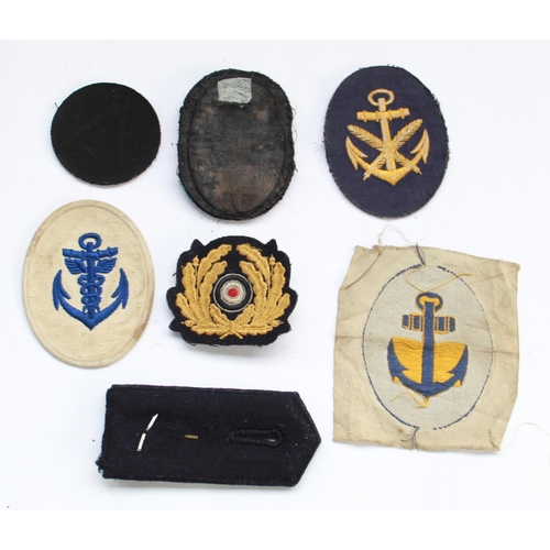 331 - WWII period German Third Reich Kriegsmarine cloth badges inc. officers epaulette rank and navigators... 