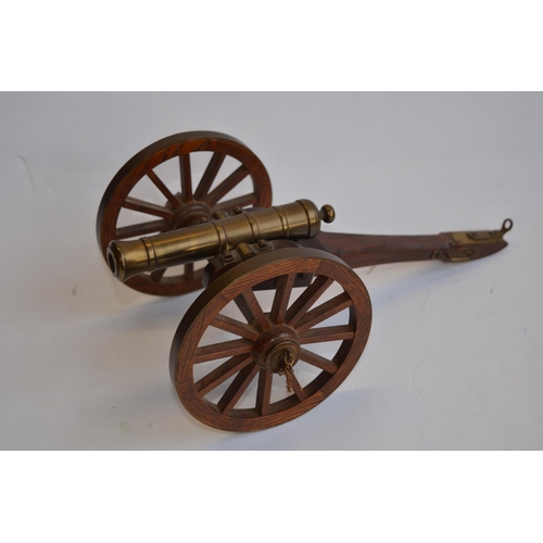 277 - 2 cast metal model cannons (non-firing), one on a base.
Larger cannon size approx 28cm long x 18cm w... 