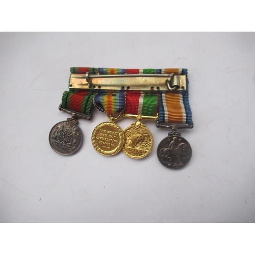 397 - Four miniature medals - 1914 - 1920 British War medal, Mercantile Marine war medal, Victory medal, D... 