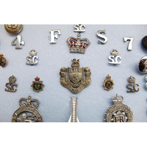 377 - Collection of British police insignia, cap badges, buttons etc. to include Cumberland and Westmorlan... 