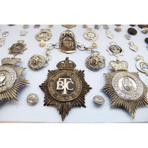 377 - Collection of British police insignia, cap badges, buttons etc. to include Cumberland and Westmorlan... 