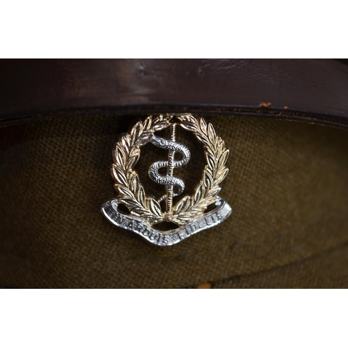 286 - A vintage British Army Royal Medical Corps officers cap with RAMC badge, by Moss Bros of Covent Gard... 