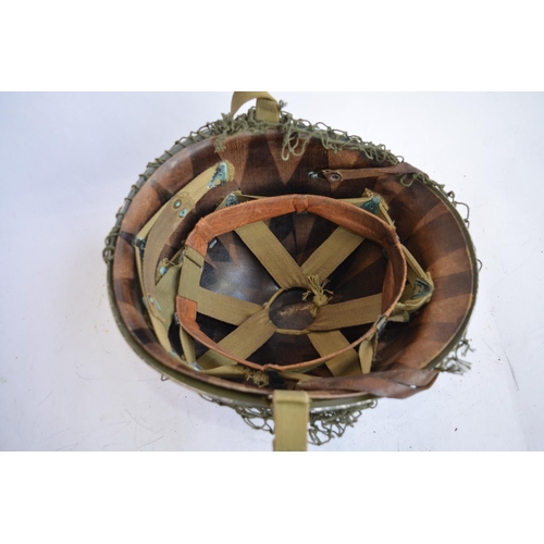 472 - A US Army WWII M1 Mk1 front seam steel helmet, with liner, chin straps etc. With 2nd Lieutenant bar ... 