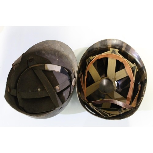 468 - Pair of WWII period M1 helmet liners, complete with webbing