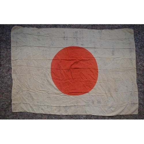 319A - WWII Japanese flag, size 102x71cm. With faded Japanese writing.