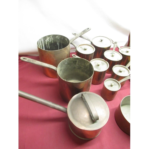 113 - C19th and later copper saucepans, some with riveted steel strap handles, other copper kitchenware in... 