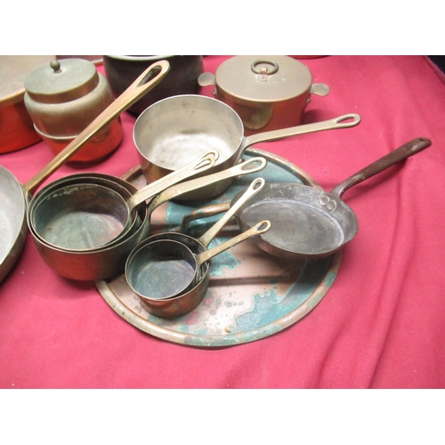 113 - C19th and later copper saucepans, some with riveted steel strap handles, other copper kitchenware in... 