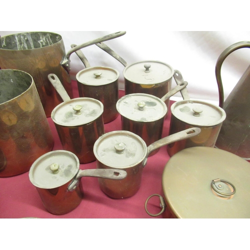 113 - C19th and later copper saucepans, some with riveted steel strap handles, other copper kitchenware in... 