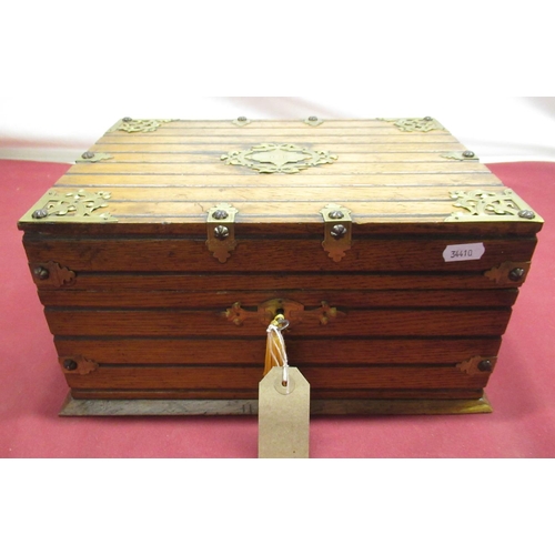 266 - Late Victorian Gothic revival oak cased and brass bound games compendium, with engraved fretwork bra... 