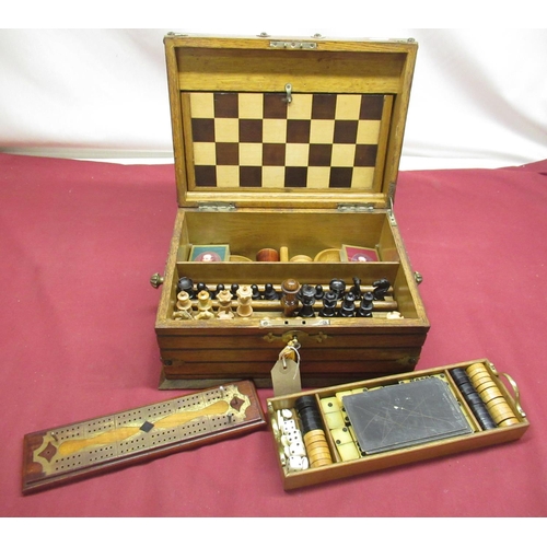 266 - Late Victorian Gothic revival oak cased and brass bound games compendium, with engraved fretwork bra... 