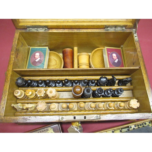 266 - Late Victorian Gothic revival oak cased and brass bound games compendium, with engraved fretwork bra... 