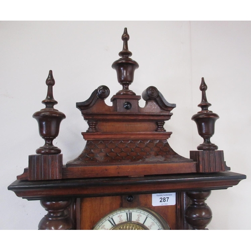 287 - Early C20th continental Vienna style walnut cased wall clock, carved pediment with turned finials, o... 