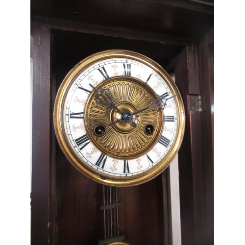 287 - Early C20th continental Vienna style walnut cased wall clock, carved pediment with turned finials, o... 