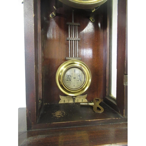 287 - Early C20th continental Vienna style walnut cased wall clock, carved pediment with turned finials, o... 