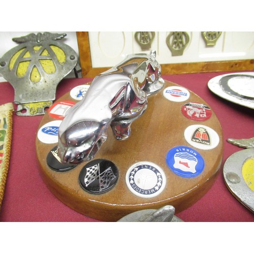 250 - Chrome plated Jaguar car mascot mounted on circular wooden base, decorated with other marks of motor... 