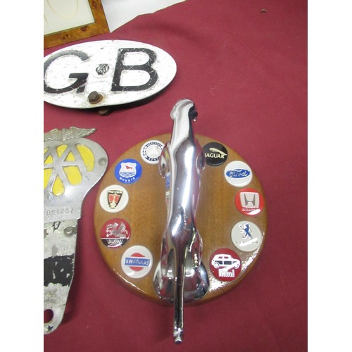 250 - Chrome plated Jaguar car mascot mounted on circular wooden base, decorated with other marks of motor... 