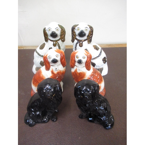 180 - Three pairs of Staffordshire type spaniels, lustre, brown and black decorated, H24cm max (6)